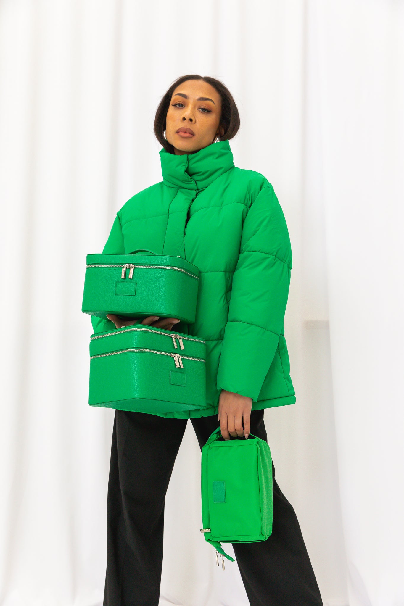 The Kelly Green Collection: Vanity Case, Duo Vanity Case, and Jet Setter Travel Case.